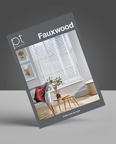 A brochure displaying made-to-measure Venetian blinds in a modern lounge with a sofa, cushions, and a small side table.