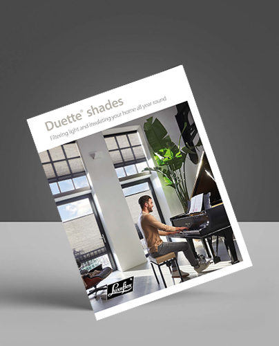 A brochure for Duette shades shows a man playing a grand piano in a bright room with large windows covered by modern blinds and sunlight streaming in. The strapline reads, Filtering light and insulating your home all year round.