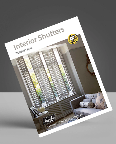 Brochure cover titled Interior Shutters: Timeless style featuring a photo of white shutters on large windows in a bright lounge with a grey sofa and patterned cushion.