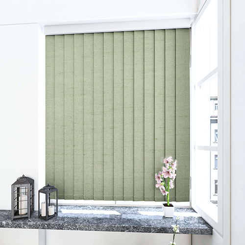 A window with closed, light green made-to-measure vertical blinds. A grey marble windowsill holds two decorative lanterns and a potted pink orchid. The open window lets in daylight.
